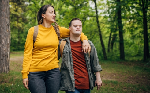 A young woman and man with Down syndrome, hiking | Law Office of Steve Cedillos