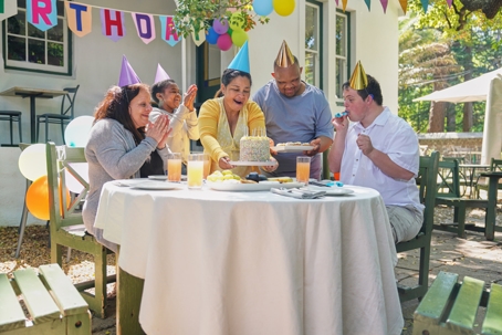 Friends with disabilities enjoying birthday party in garden | Law Office of Steve Cedillos